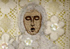 <strong>Mother´s Grave</strong>, 2007<br />
<em>Size:</em>  18,5 x 46,6 x 8 cm<br />
<em>Technique:</em>  hand-made embroidery<br />	
<em>Material:</em>  silk, pearls, cotton, painted wood