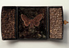 <strong>Lappet Moth</strong>, 2011<br />
<em>Size:</em> 11,5 x 21 x 1 cm<br />
<em>Technique:</em>hand embroidery, mixed media<br />	
<em>Material:</em> silk threads, velvet, Annual Honesty -seedpods, old box