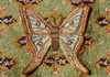 <strong>Spanish Moon Moth</strong>, a detail 2013<br />
<em>Size:</em> 11 x 20 x 7 cm<br />
<em>Technique:</em> hand embroidery, mixed media<br />	
<em>Material:</em> silk threads, drift store fabric, tin box