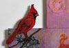 <strong>Cardinal Bird</strong>, 2017<br />
<em>Size:</em> 32 x 46,5 x 1 cm<br />
<em>Technique:</em> hand embroidery, machine embroidery, mixed media<br />	
<em>Material:</em> silk threads, viscose threads, pearls, oil colour, mdf-board